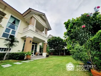 Stunning two-story house with lush garden and spacious lawn