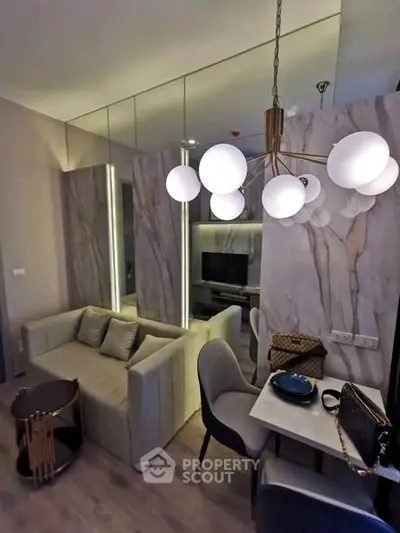 Modern living room with elegant lighting and stylish furniture in a contemporary apartment.