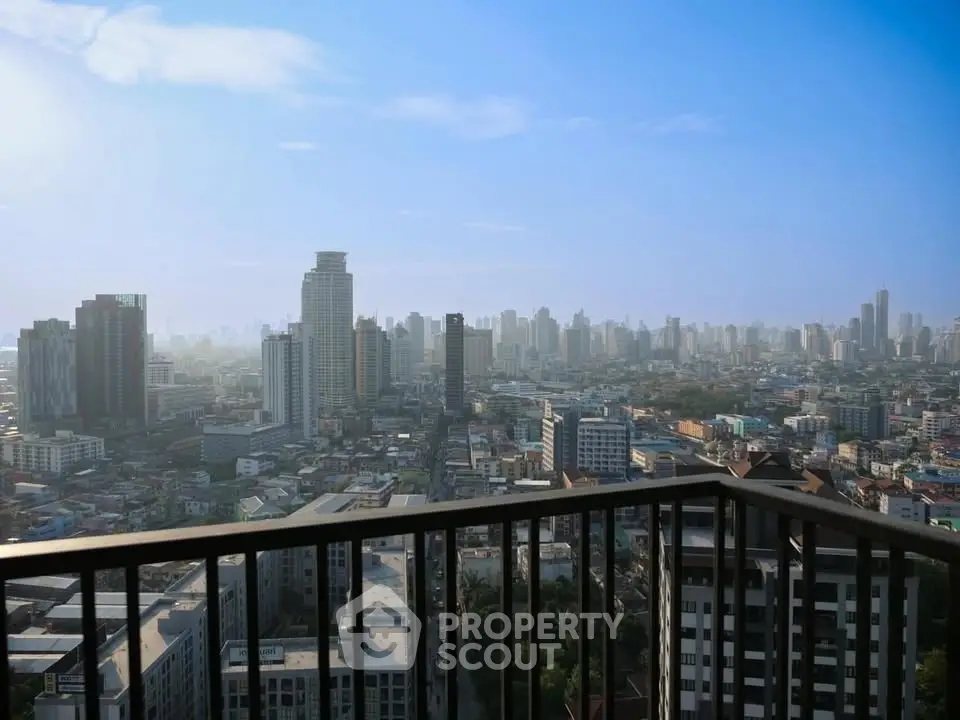 Stunning cityscape view from a high-rise balcony, showcasing urban skyline and vibrant city life.