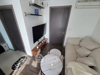 Cozy living room with modern decor and wall-mounted TV