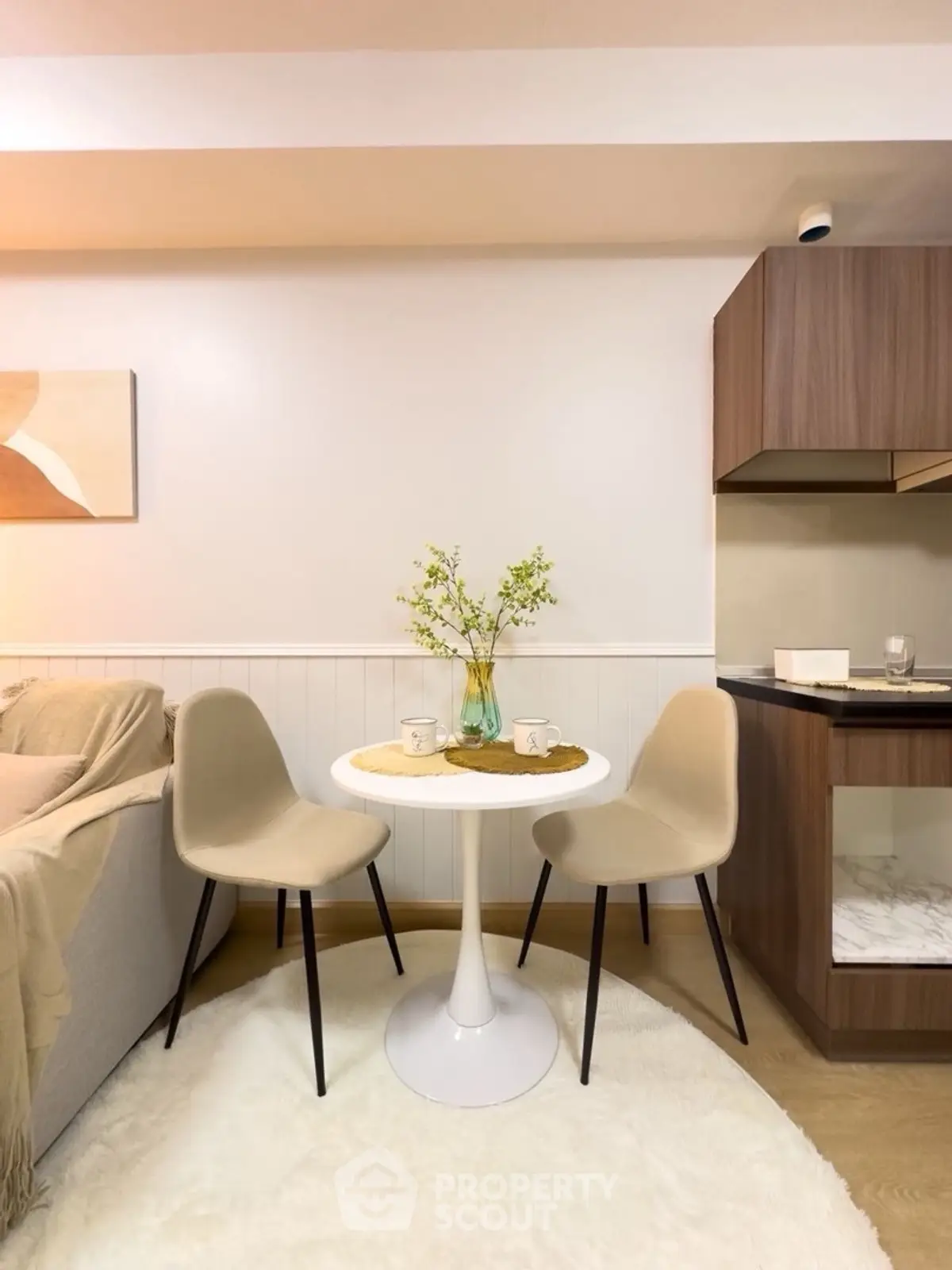 Cozy dining nook with modern chairs and table in stylish apartment