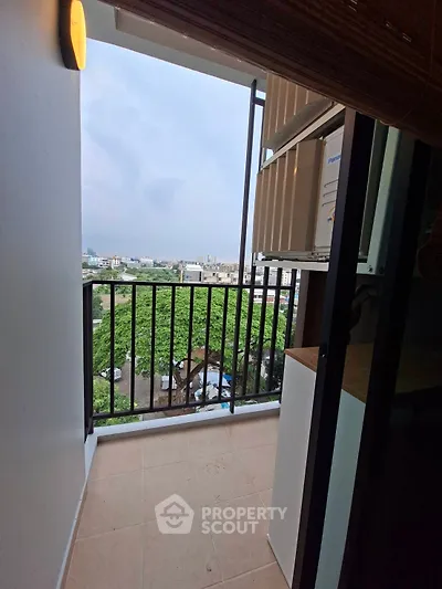 Charming balcony with scenic city view, perfect for relaxation and enjoying the outdoors.