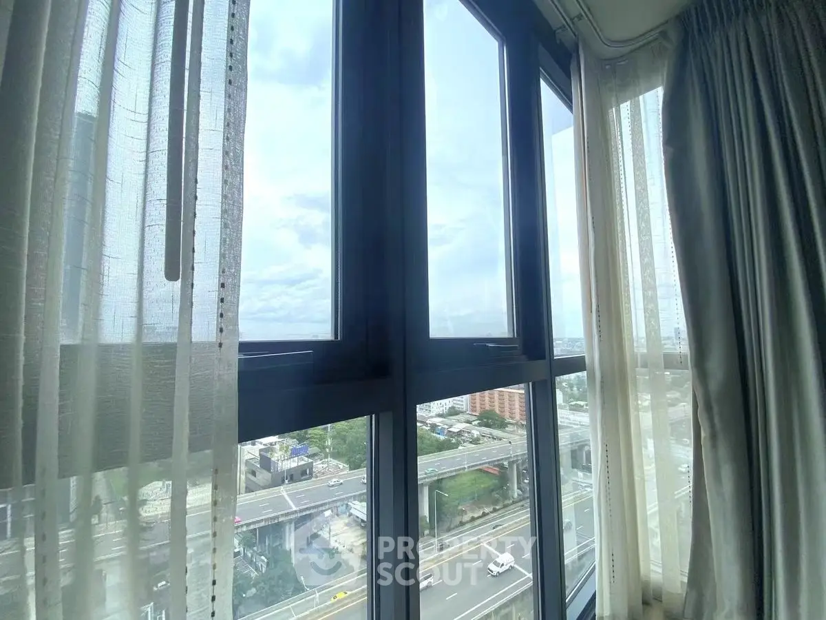 Stunning cityscape view from modern high-rise apartment window