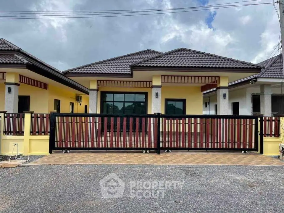 Charming single-story home with modern design and spacious driveway, perfect for family living.