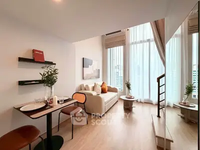 Modern living room with high ceilings and large windows offering city views, featuring stylish decor and cozy seating.