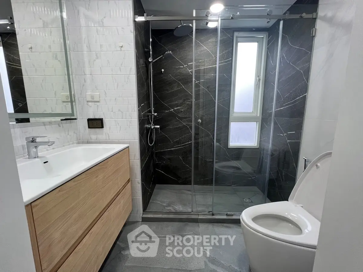 Modern bathroom with sleek design and glass shower enclosure