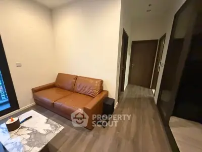 Cozy living room with brown leather sofa and modern decor