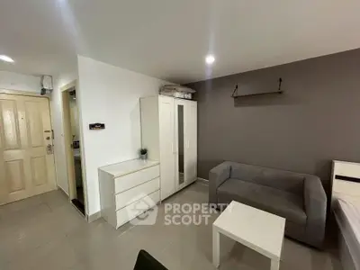 Modern living room with sleek furniture and neutral tones, perfect for cozy urban living.