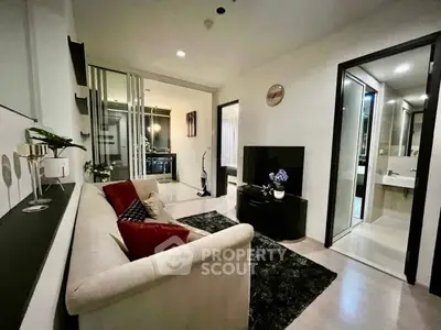 Modern living room with sleek design, cozy sofa, and elegant decor in a stylish apartment.