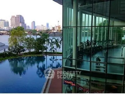 Luxurious riverside property with pool and modern gym facilities.