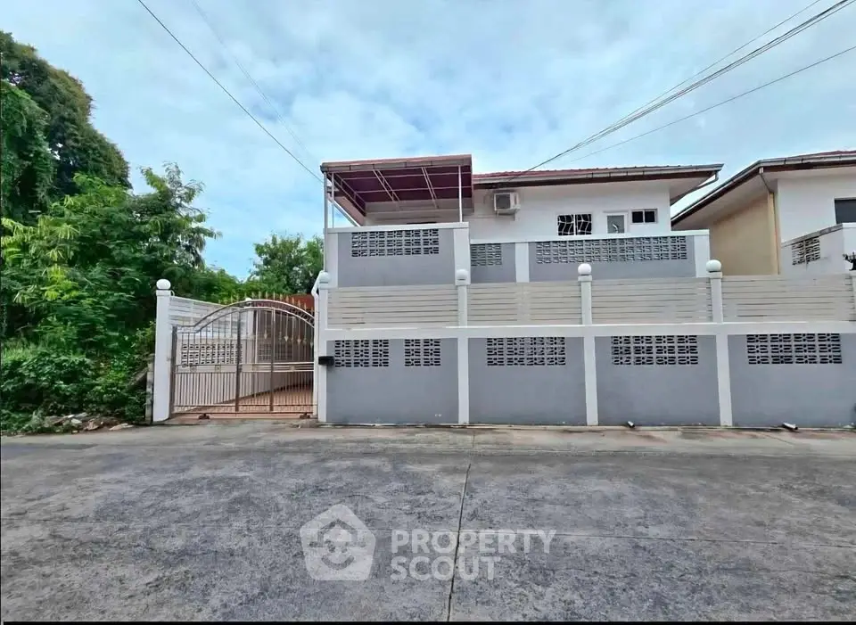 Charming suburban house with gated entrance and spacious driveway