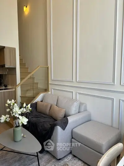 Modern living room with elegant decor and cozy seating area