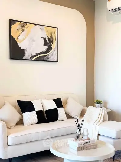 Stylish modern living room with elegant decor and cozy seating area.
