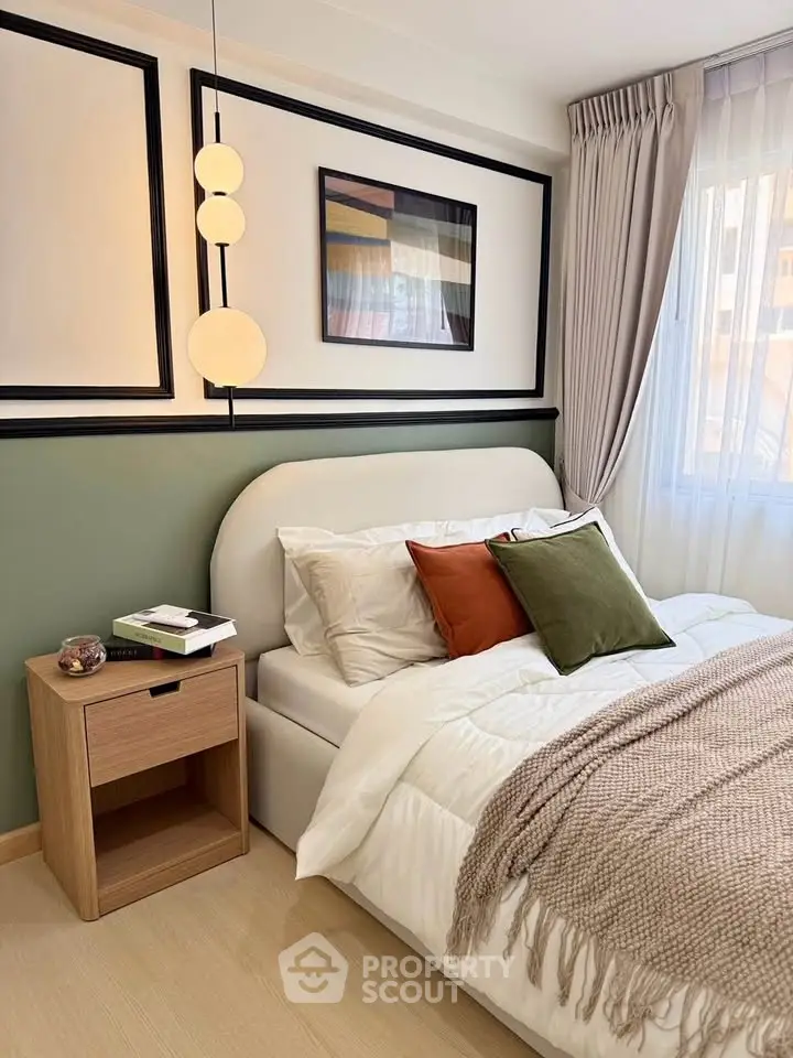 Stylish bedroom with modern decor, cozy bed, and elegant lighting in a chic apartment.