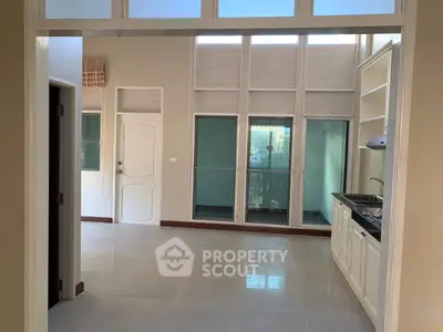 Spacious open-plan kitchen with modern design and ample natural light.