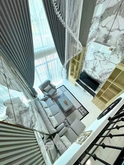 Luxurious modern living room with high ceilings and elegant decor