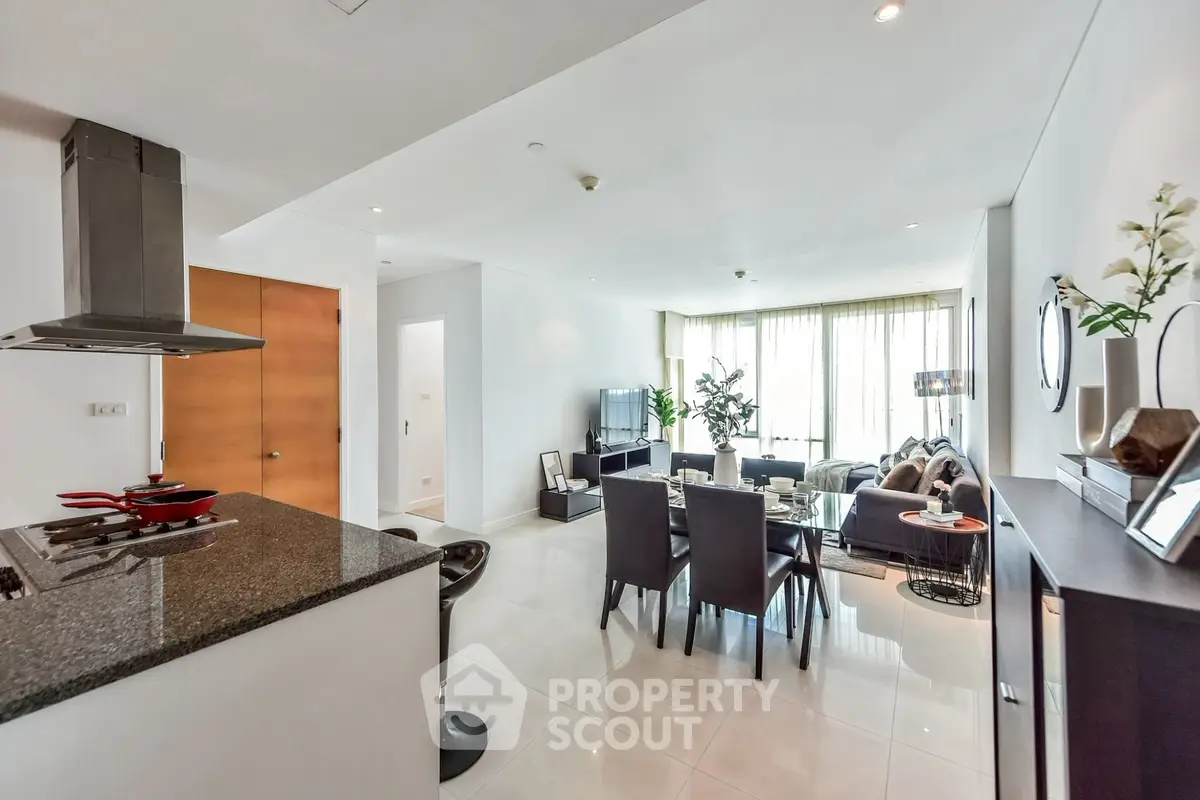 Spacious modern living room with open kitchen and elegant dining area