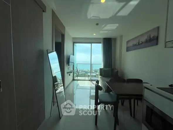 Modern living room with ocean view and sleek furniture