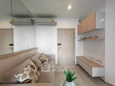 Modern living room with stylish decor and air conditioning in a contemporary apartment.