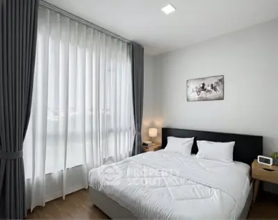 Modern bedroom with large window and elegant decor