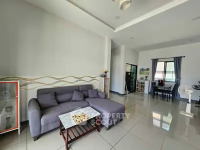 Spacious living room with modern gray sectional sofa and elegant decor