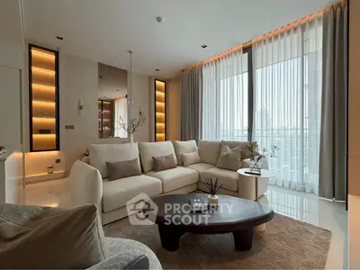 Luxurious modern living room with floor-to-ceiling windows and elegant decor.