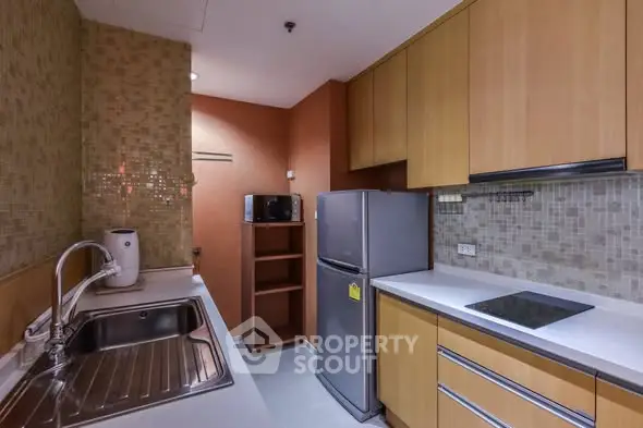 Modern kitchen with sleek cabinetry and stainless steel appliances