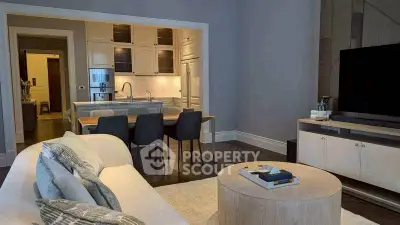 Modern living room with open kitchen layout and stylish decor