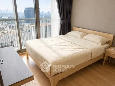 Modern bedroom with city view and natural light in high-rise apartment
