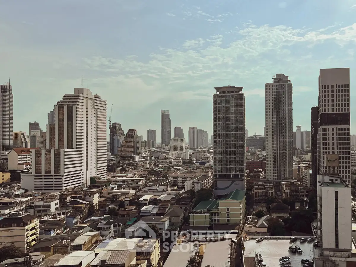 Stunning cityscape view showcasing modern high-rise buildings under a clear blue sky.
