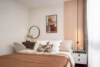 Cozy modern bedroom with stylish decor and natural light