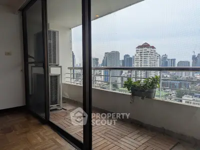 Spacious balcony with city view, perfect for relaxation and enjoying the skyline.