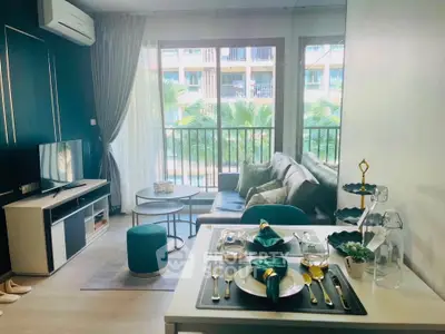Chic living room with modern decor and balcony view in stylish apartment