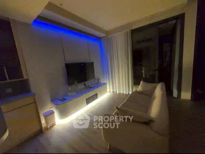 Modern living room with ambient lighting and sleek furniture design