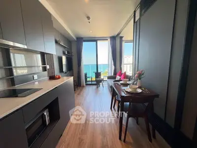 Modern kitchen and dining area with ocean view in luxury apartment