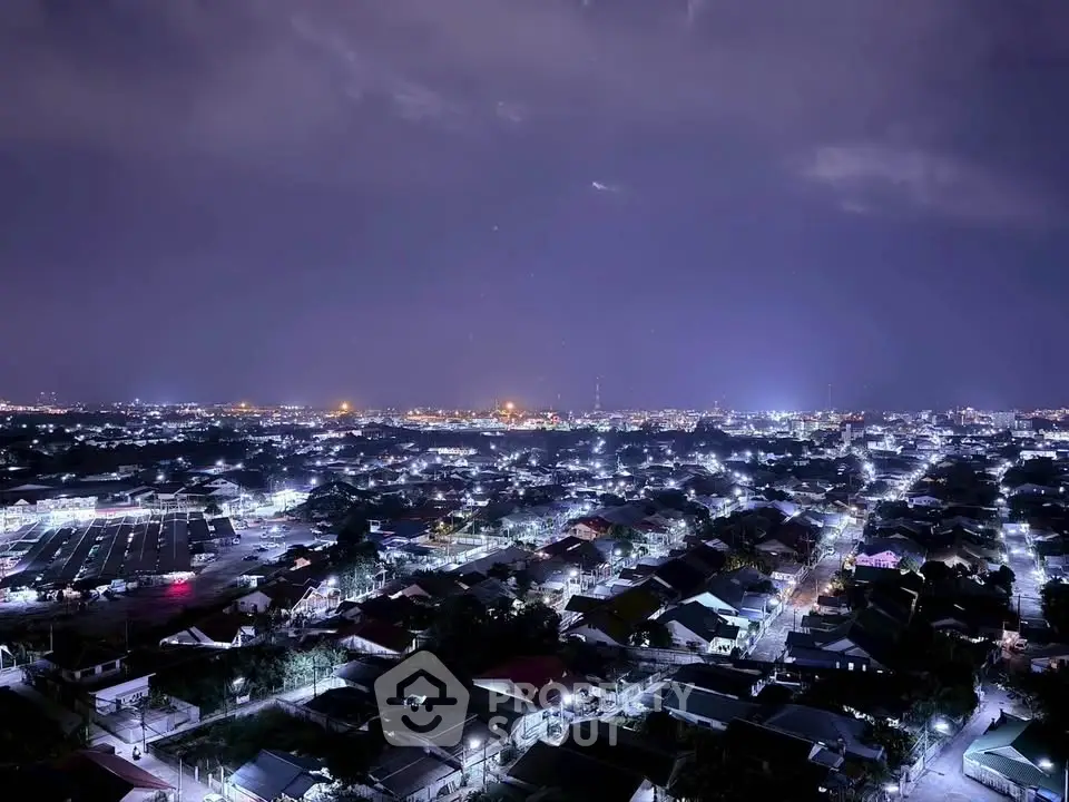 Stunning night cityscape view showcasing vibrant urban lights and expansive skyline.