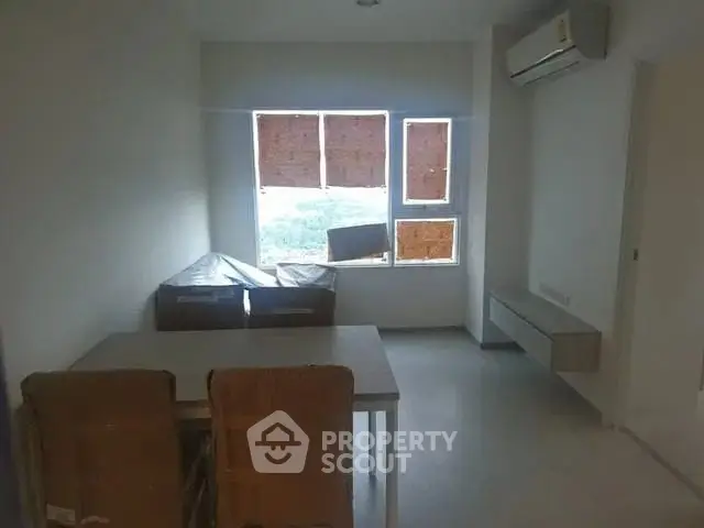 Cozy living room with air conditioning and modern furniture, perfect for relaxation.