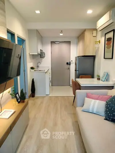 Modern apartment living room with open kitchen and stylish decor