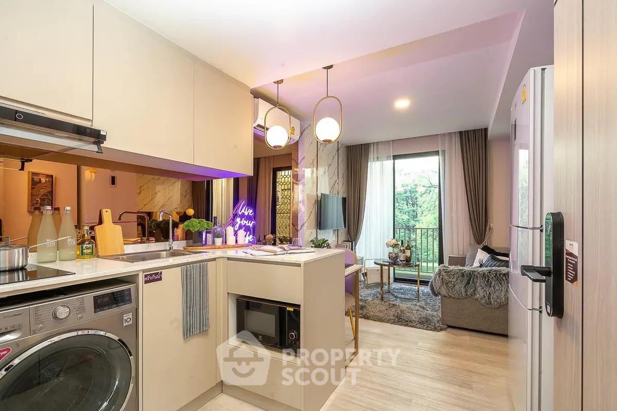 Modern open-plan kitchen and living room with stylish decor and balcony view