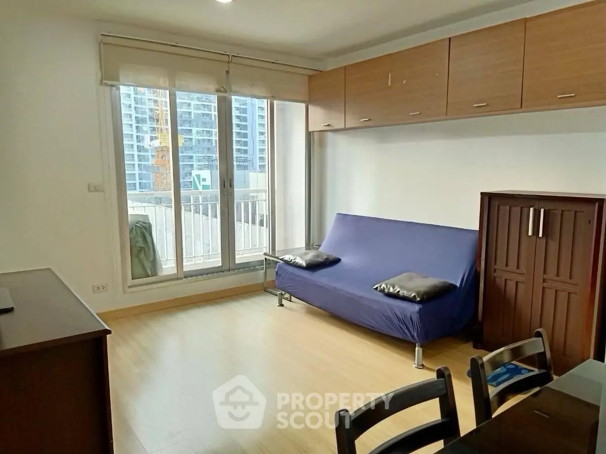 Modern living room with balcony view in urban apartment