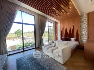 Luxurious bedroom with floor-to-ceiling windows and elegant wooden ceiling design.