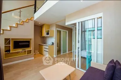 Modern duplex living room with open kitchen and stylish decor