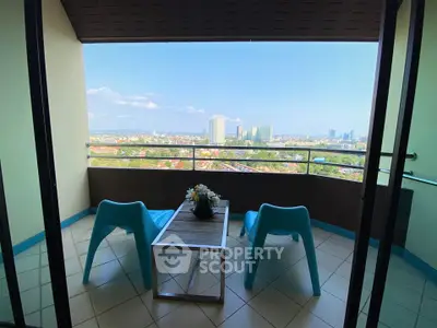 Stunning balcony with panoramic city view and modern seating arrangement