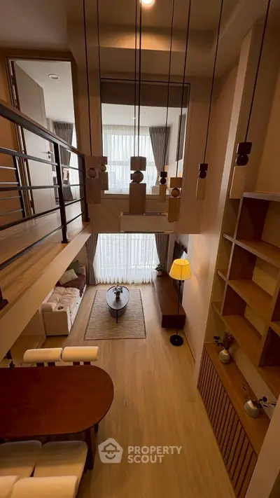 Stunning loft-style living room with high ceilings and modern decor