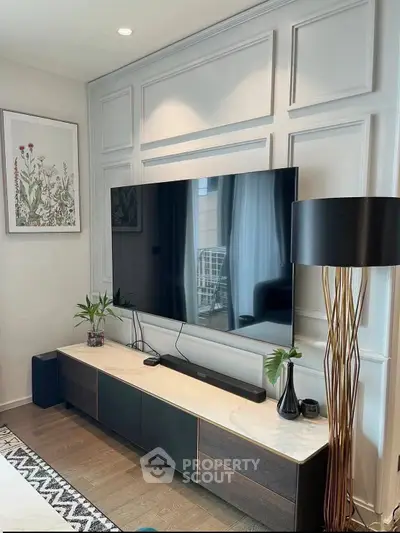 Modern living room with sleek TV setup and elegant decor