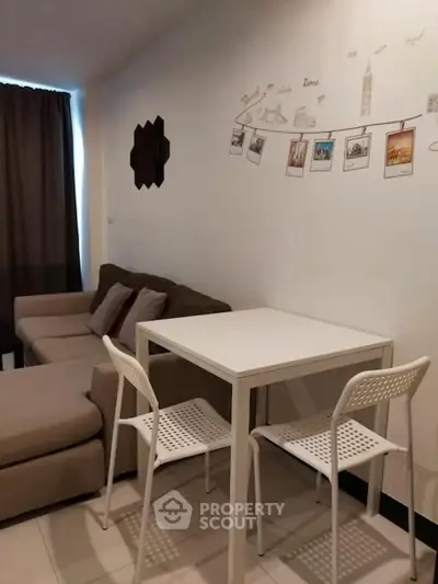 Cozy living room with modern decor and comfortable seating in a stylish apartment.