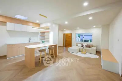 Spacious modern living room with open kitchen and stylish decor