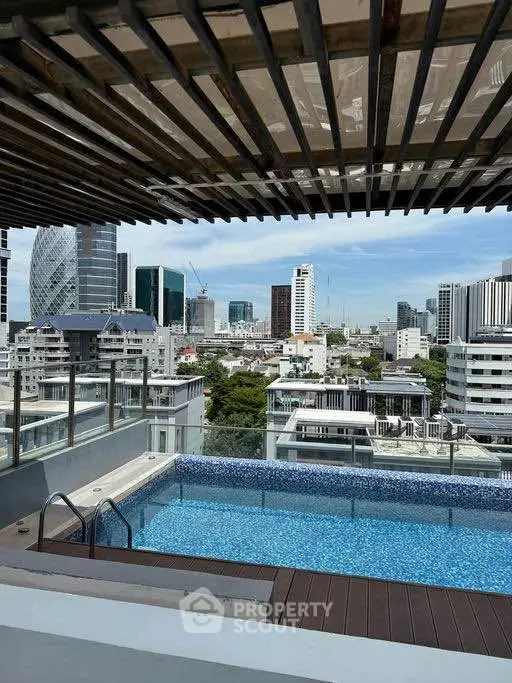 Stunning rooftop pool with panoramic city views in a modern urban setting.
