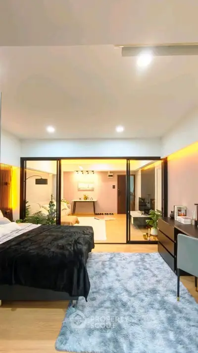 Luxurious bedroom with modern decor and spacious layout, featuring a cozy bed and stylish furnishings.