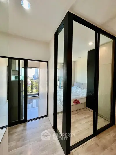 Modern apartment with glass-enclosed bedroom and balcony view